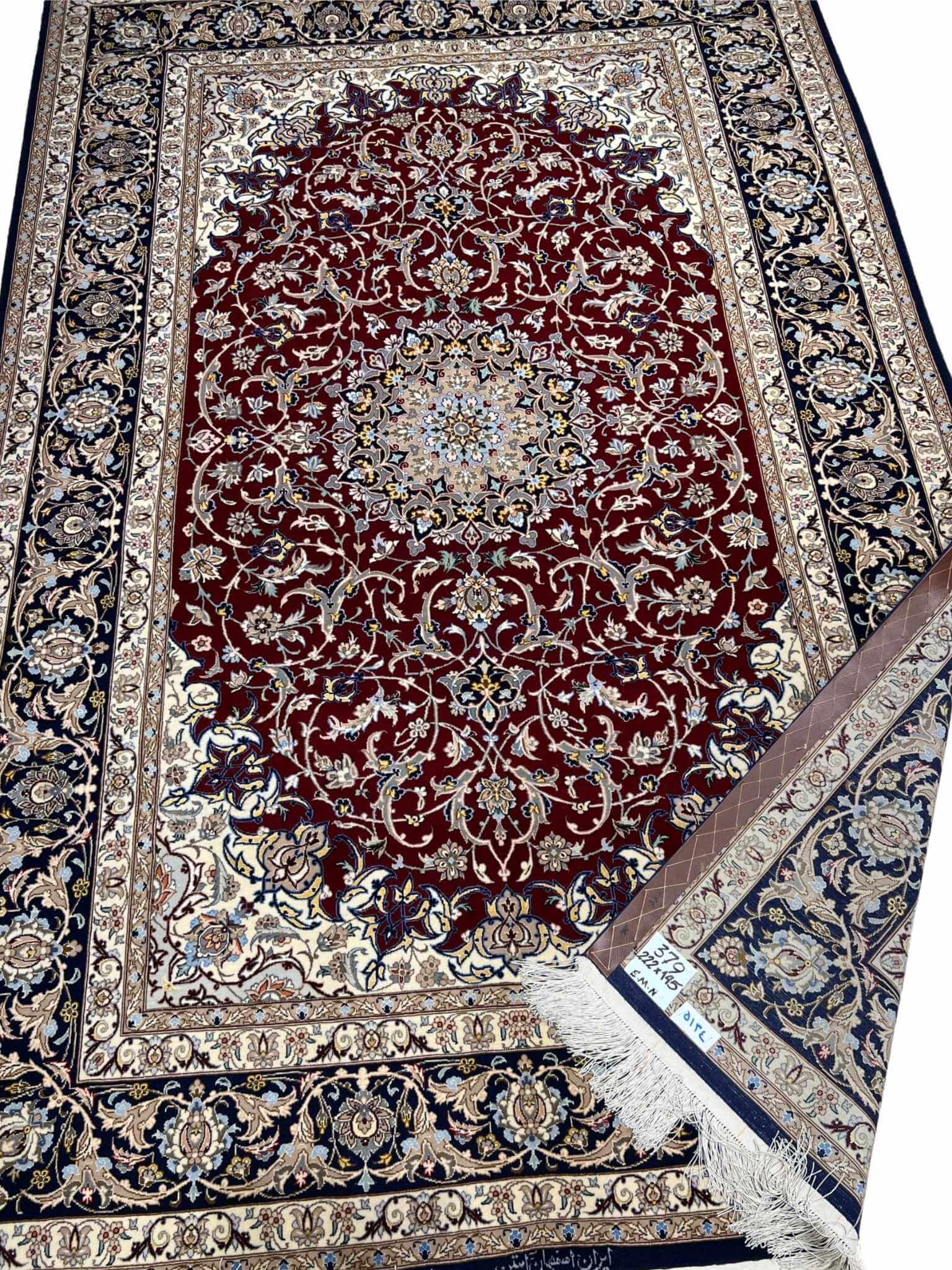 Luxury hand-knotted wool and silk Isfahan carpet.